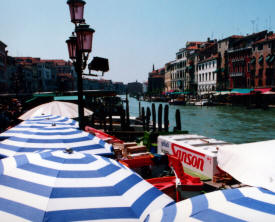 Sun umbrellas on the Venice canal More Italy Photography -  Venice, Florence, Rome,  Ancient Roman towns ...photography by Bill Bell