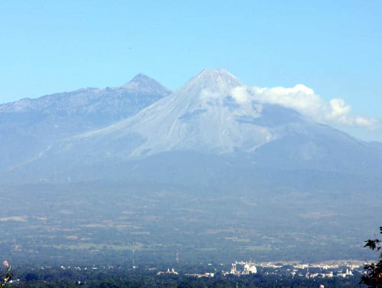 The majestic Colima Volcano, one of Mexico’s most active, creates a dramatic backdrop to the city.