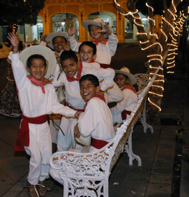 Young folklorico dancers share joy and tradition, embodying the cultural vibrancy of Colima.